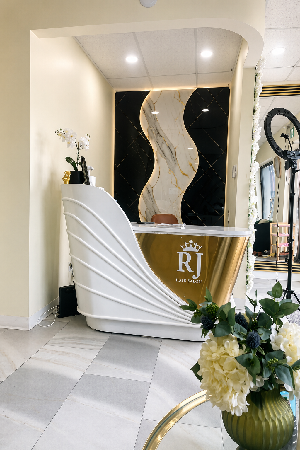 RJ Hair Salon & Spa luxury reception desk with gold and white marble design